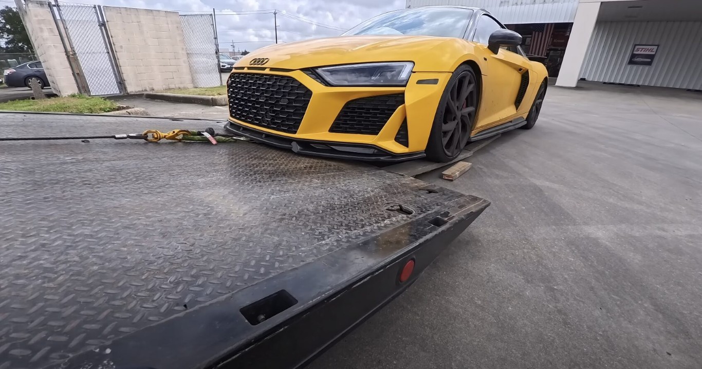 Flatbed tow truck safely transporting luxury sports car in Papillion, Nebraska
